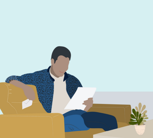 A person sitting in an armchair reading a letter.